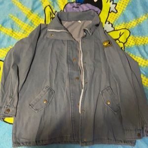 Blue denim Jacket with black and gold patch